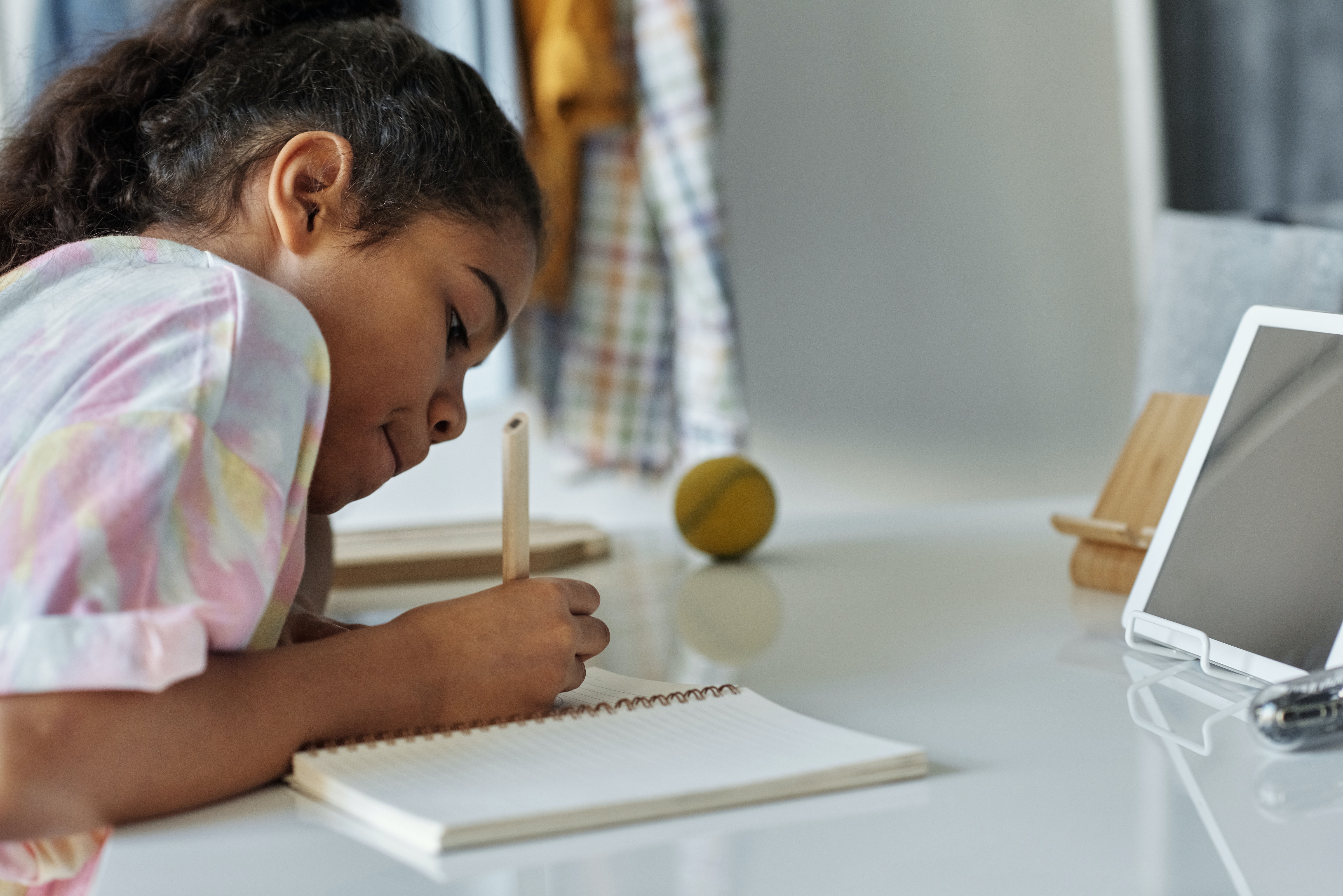 A student writing in a  notebook