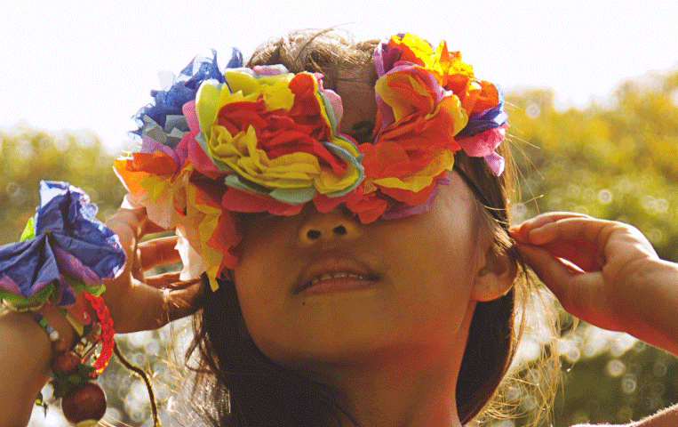 Image of A young girl with flowers in her hair.